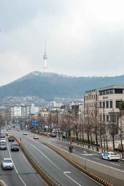 stock image Seoul, South Korea - 19 February 2023: View of N Seoul Tower from Noksapyeong Bridge, one of the famous locations from Korean drama called Itaewon Class