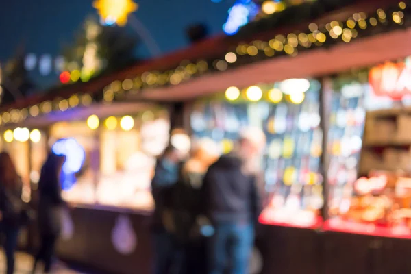 Bulanık görüntü bokeh yürüme, kış harikalar diyarı, Hyde Park, Londra bir Noel pazarda alışveriş insan.