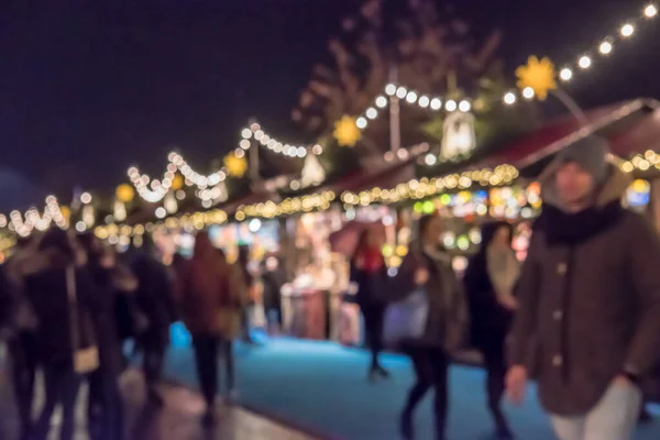 stock image Blurred image bokeh of People walking, shopping at Edinburgh Christmas Market. New Year.