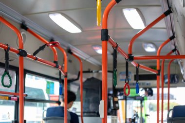 Interior view of the bus with hand grip, in Seoul, South Korea clipart