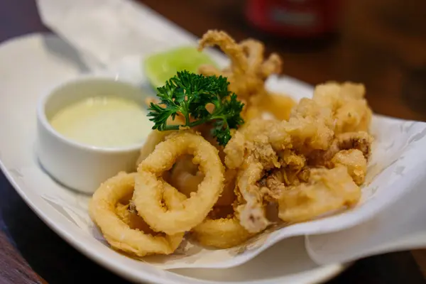 Close up of Fried Squid, Calamari served on plate.
