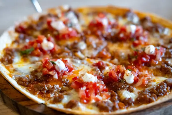 stock image Nacho with minced meat and tomato salsa sauce