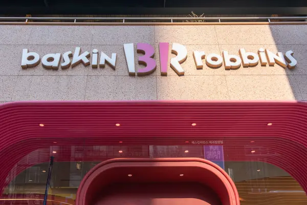 stock image Seoul, South Korea - 19 March 2024: Exterior view and signage in front of the shop Baskin-Robbins, Gangnam branch. It is an American multinational chain of ice cream and cake specialty shop