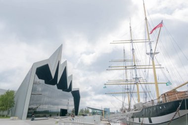 Glasgow, Scotland - 18 July 2016 - Riverside Museum of Transport which has models of cars, bycicles and ships, designed by famous architect Zaha Hadid clipart