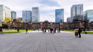 Tokyo, Japan - Dec 3, 2022: Timelapse of Japanese people, Asia traveler walk at Tokyo Station building. Train transportation, Asia travel tourism landmark, tourist attraction or Asian city life