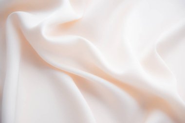 Pürüzsüz ipek ya da saten lüks kumaş dokusu düğün arka planı olarak kullanılabilir. Lüks arka plan tasarımı. Erecru tonunda. Retro tarzı. Yumuşak fokus.