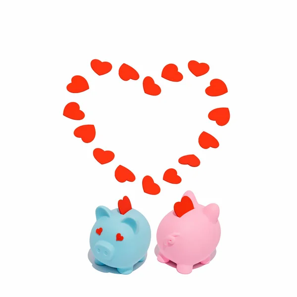 Pink and blue piggy banks in love with red hearts. Concept of love, money and savings.