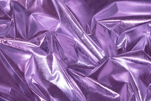 Abstract purple crumpled foil background. Minimal party concept.