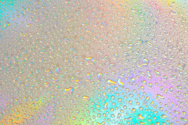 Blurred defocused abstract iridescent foil wallpaper texture. Holographic soft pastel colors backdrop. Trendy creative gradient. Colorful rainbow gradient poster, banner background. Minimal liquid owerflow, unicorn aesthetic concept.