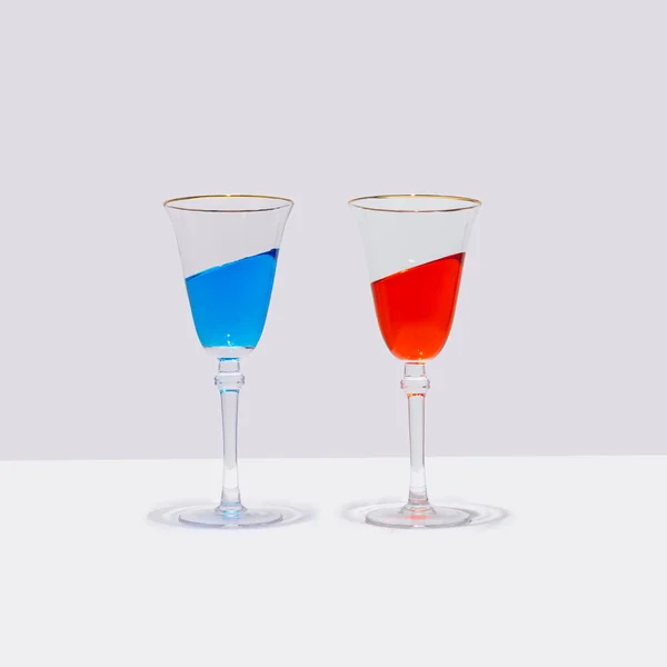 Two Colorful Cocktail Glasses Stand Straight Drink Them Inclined Angle — Foto Stock