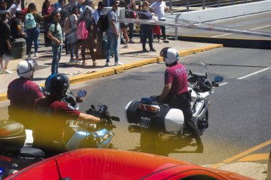 buenos aires, argentina - november 4 2022: police persons from the policia de la ciudad with helmets on motorcycles on the street