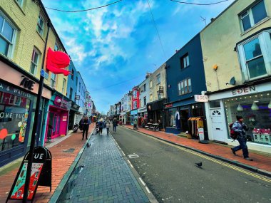 Brighton, United Kingdom - March 04 2022: people passing by stores and shops in vibrant small british street