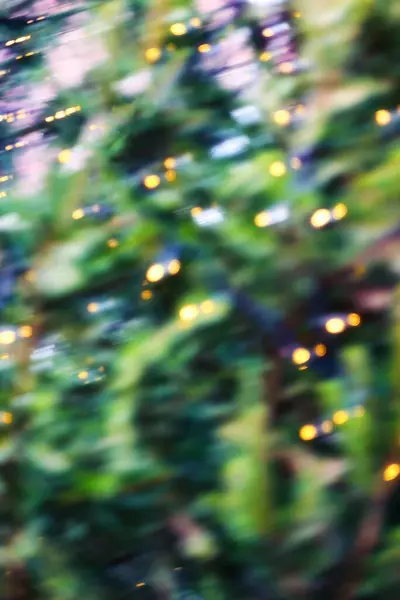 a background picture of festive bokey blurry christmas lights during the holiday season