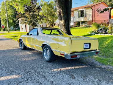port perry, canada - august 12 2023: a vintage chevrolet el camino american car has been parked at a house in a suburban neighborhood clipart