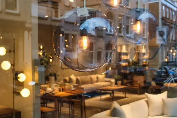 stock image The Hague, Netherlands - January 03 2022: several lamps are placed near a brown sofa in a interior decorating store with product for the home