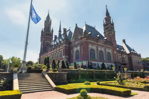 stock image The Hague, Netherlands - July 22 2019 : The exterior of the almost castle like Peace Palace in his gardens . In use by the International Court of Justice of the United Nations.