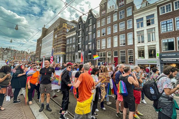 The Hague, Netherlands - 23 August 2021: many people participate to a pride walk in the center of historic amsterdam