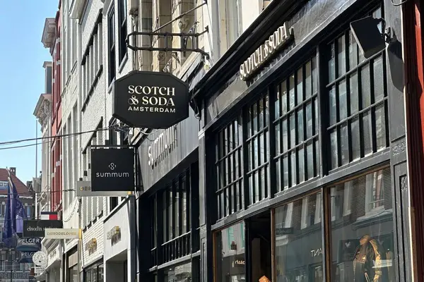 stock image the hague, netherlands - may 02 2024: the entrance and logo on the facade at an outlet of the dutch retail chain Scotch and Soda