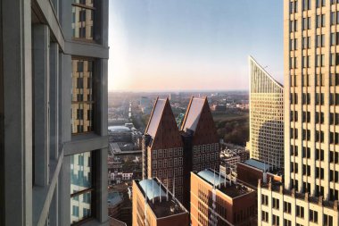 The hague, netherlands - april 08 2017 : view from o residential skyscraper with view of ministeries of dutch government clipart