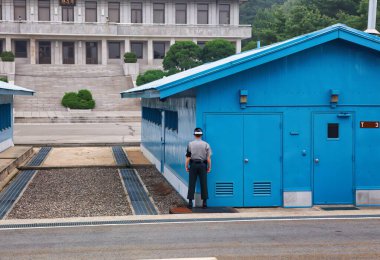 Panmunjom, South Korea - June 16 2010 : the highly militarized border between the two koreas and Panmunjeom united nations peace village in between clipart