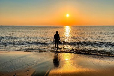 Den Haag, Netherlands - June 16 2021: people are enjoying sun and beach and admiring the sunset