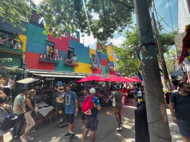 buenos aires, argentina - 29 October 2022 : tourists walking around the colorful and popular la boca neighborhood with shops and stores