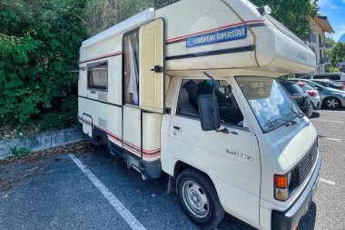 talloires, france - 05 September 2022: a european camper or motor home parked on a parking with european superstar sign