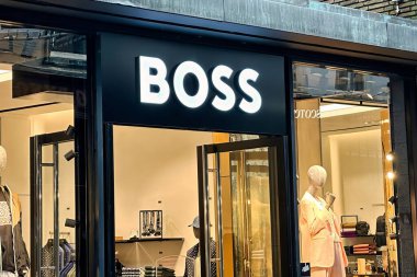 The Hague, netherlands - january 23 2023: store front and sign of a store of the german boss clothing fashion chain clipart