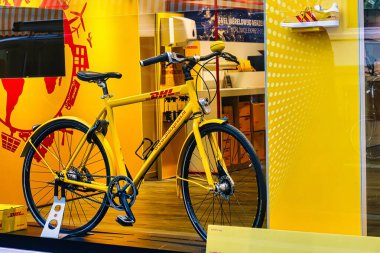 The Hague, Netherlands - January 03 2022: shipments and parcels can be dropped at this fast delivery service outlet store with a bicycle on display