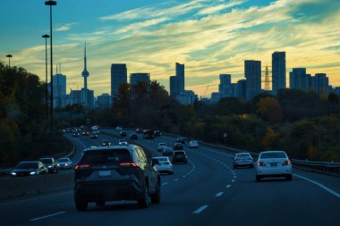 toronto, canada - 23 October 2022: cars driving in a traffic jam on a highway or parkway into the city