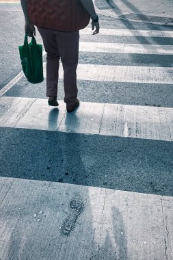 toronto, canada - 25 October 2022: person at pedestrian crossing a road on gay church street