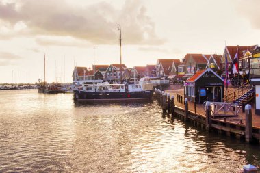 volendam, netherlands - 08 October 2022: a sail bot is docked in the historic harbor of a dutch village