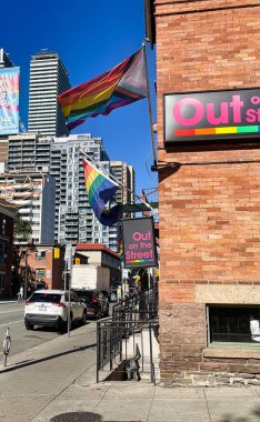 toronto, canada - 24 October 2022: a progress rainbow lgbtqa flag on gay church street with bars restaurants shops and gay or lgbtq clubs
