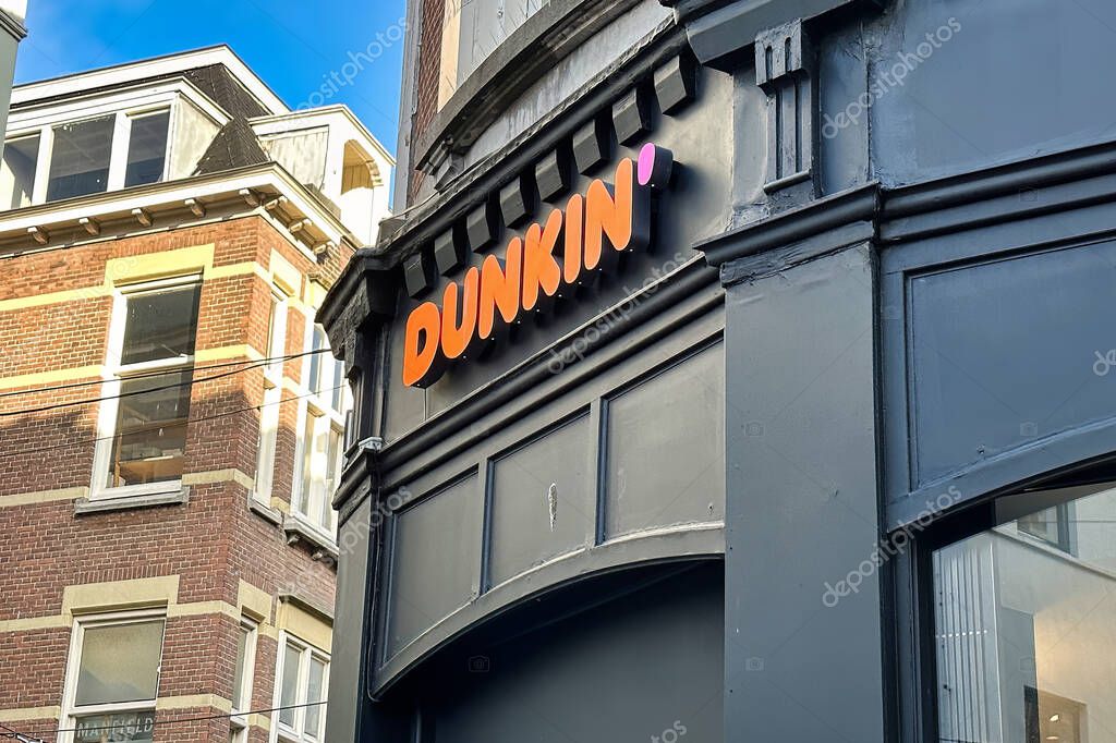 The Hague, netherlands - january 23 2023: store front and sign of a store of dunkin donut fast food chain