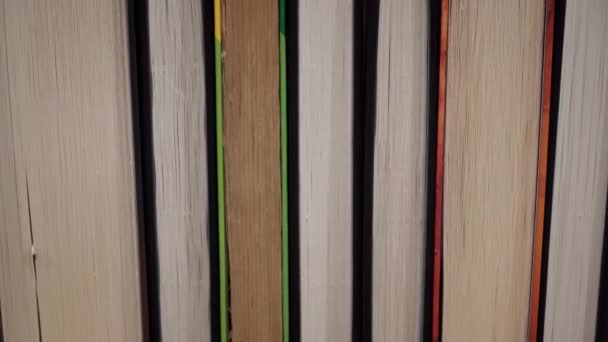 Young Girl Chooses Book Shelf Books Library Bookshelves Background Stack — Vídeo de Stock
