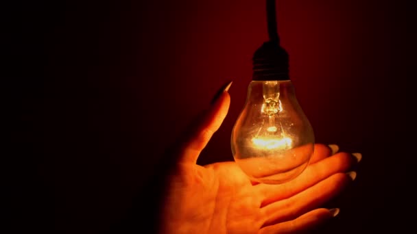Light Bulb Turns Goes Out Touch Persons Hand Dark Slow — Stok video