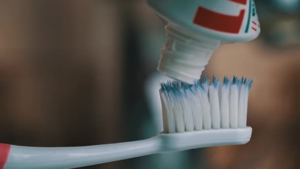 Toothpaste Climbs Out Tube Toothbrush Close Apply Toothpaste Brush Morning — 图库视频影像