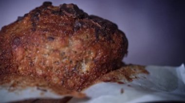 Appetizing chocolate muffin rotates and there is place for inscription on side. Delicious dessert spinning. Ready to eat cupcake with crispy crust on background. Dessert decorated with dark chocolate.