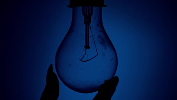 Light Bulb Turns Goes Out Touch Persons Hand Dark Slow — 图库视频影像