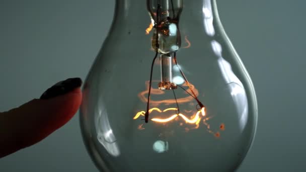 Light Bulb Turns Goes Out Touch Persons Hand Dark Slow — Video Stock