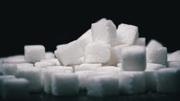 Pile White Sugar Cubes Black Background Sweets Harmful Health Harm — Stock Video