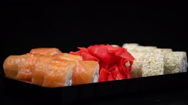 Sushi Roll Spinning Black Container Close Japanese Cuisine Sushi Restaurant — Stock videók