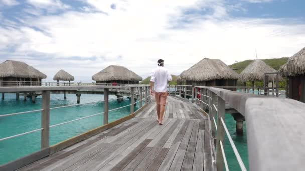 Man Walking Water Villas Bora Bora Tahiti French Polynesia Luxury — Vídeo de Stock