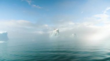 Jokulsarlon glacier Lagoon, Iceland. Stunning icebergs floating in lagoon hidden in the mist, powerful message of climate change in Iceland. High quality 4k footage.