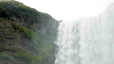 4K footage of Skogafoss Waterfall in the South of Iceland. Close-up view of Skogafoss, Icelands famous Ring Road waterfall. View of Skogafoss, magnificent natural wonder. 