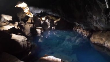 Grjotagja volcanic cave with blue hot thermal water near Lake Myvatn in Iceland. The thermal bath in a grotto. The geothermal cave. Areas of Iceland present in the Game of Thrones. High quality 4k