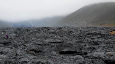 4K close-up footage of Cold Lava in Fagradalsfjall active volcano in Geldingadalir, Reykjanes, Iceland. River of Cold Lava Flowing down the hill.