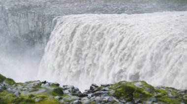 Dettifoss The largest waterfall in Iceland. Close up of water falling from Dettifoss waterfall in abstract. Movement of water falling. Power of water. High quality 4k footage.