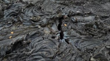 4K close-up footage of Cold Lava in Fagradalsfjall active volcano in Geldingadalir, Reykjanes, Iceland. River of Cold Lava Flowing down the hill.