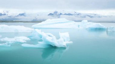 Jokulsarlon glacier Lagoon, Iceland. Stunning icebergs floating in lagoon, powerful message of climate change in Iceland. Perfect light and weather. High quality 4k footage.